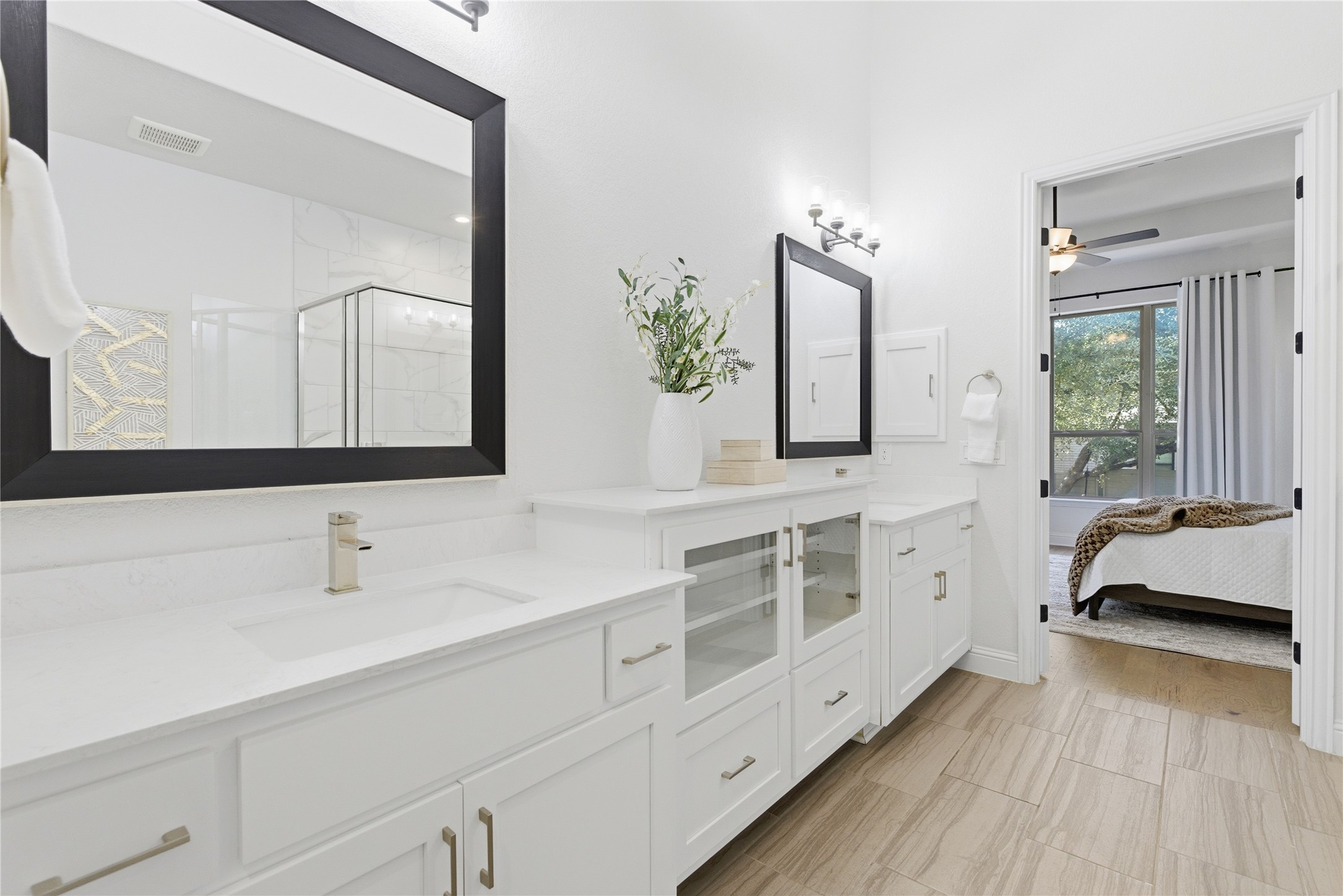225 Diamondback Drive Georgetown, TX 78628 - Photo 20 of 39 Bathroom with a marble finish shower, vanity, connected bathroom.