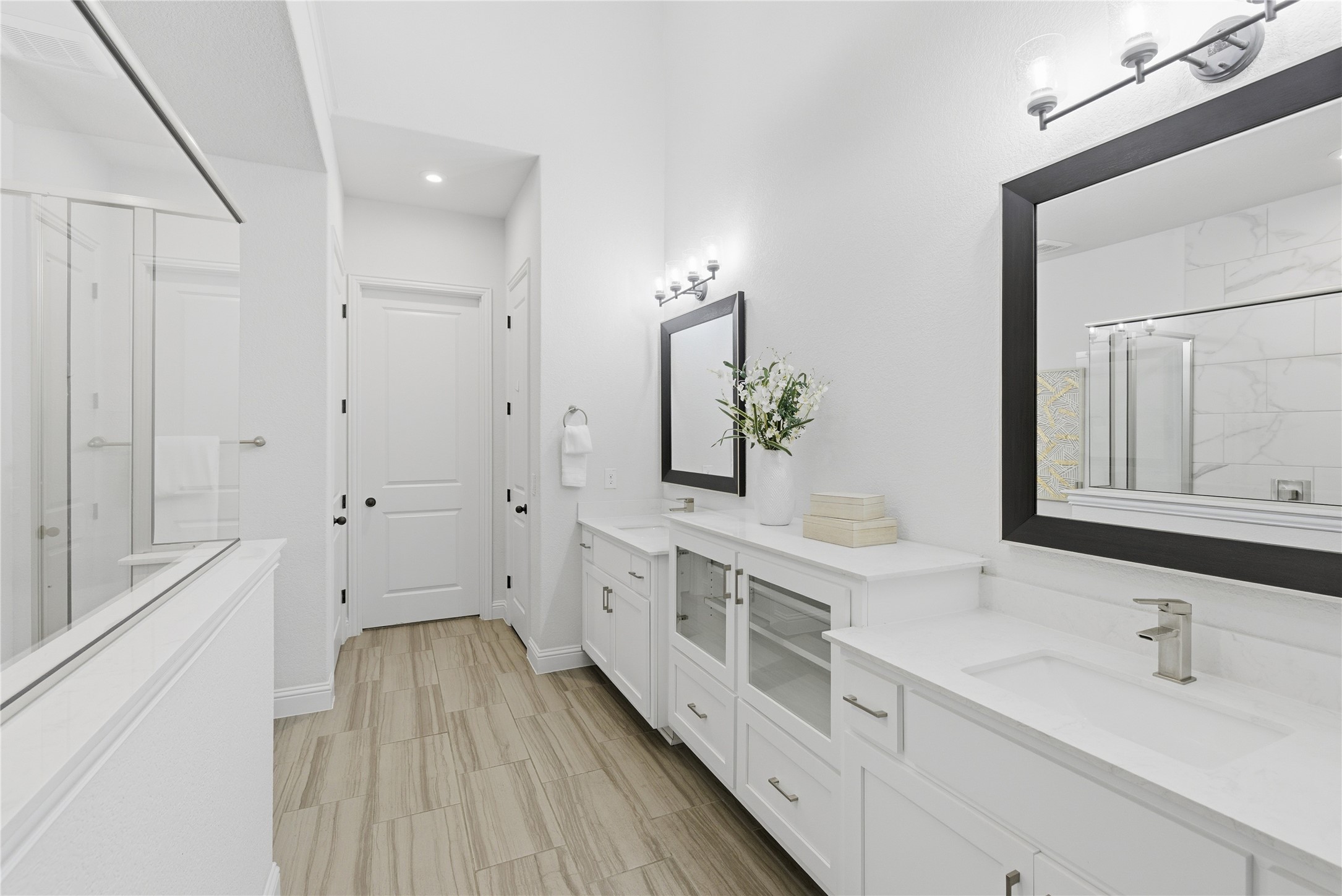225 Diamondback Drive Georgetown, TX 78628 - Photo 24 of 39 Full bath featuring a shower with shower door and two vanities.