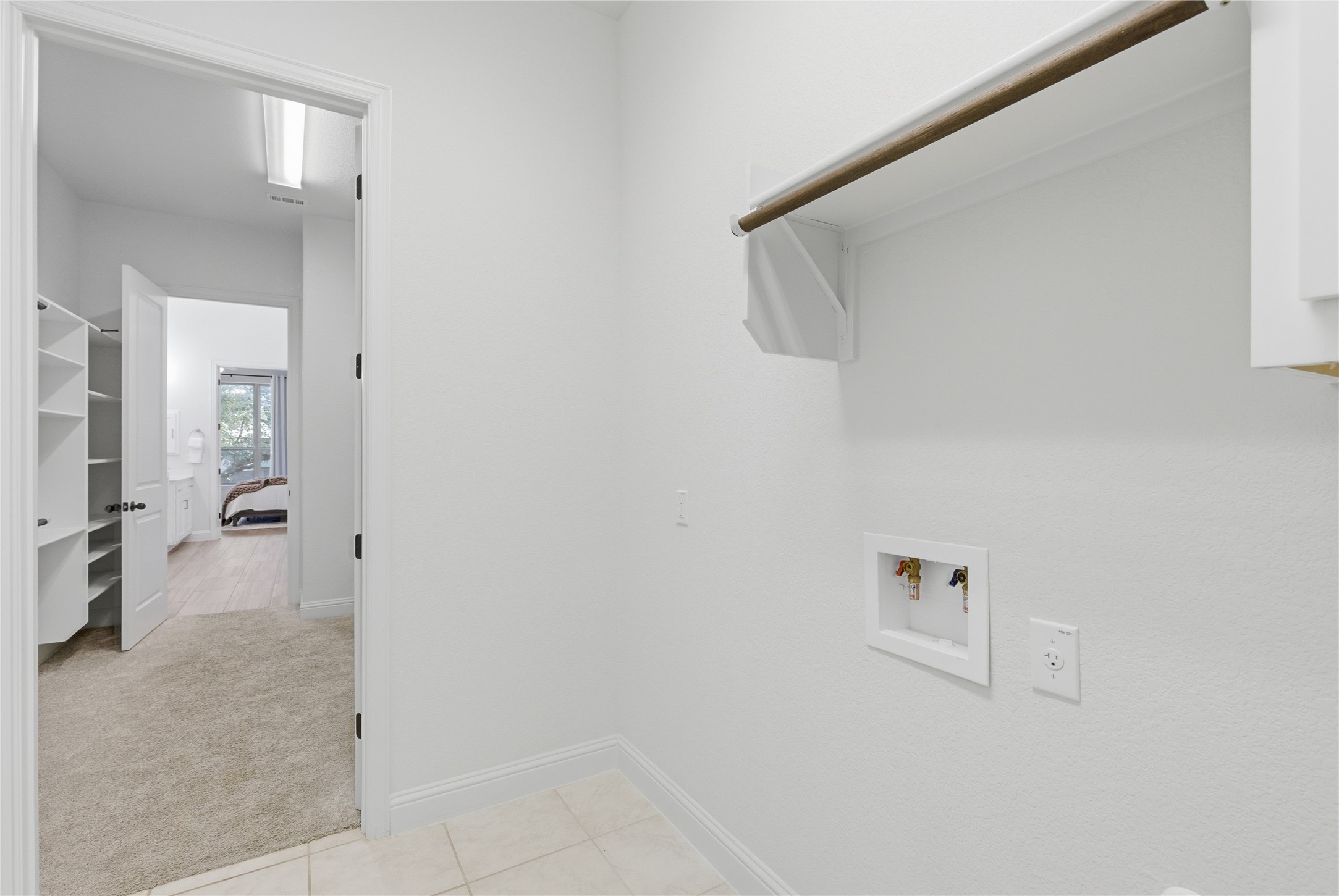 225 Diamondback Drive Georgetown, TX 78628 - Photo 26 of 39 Laundry area with light tile, washer hookup & dryer hookups.