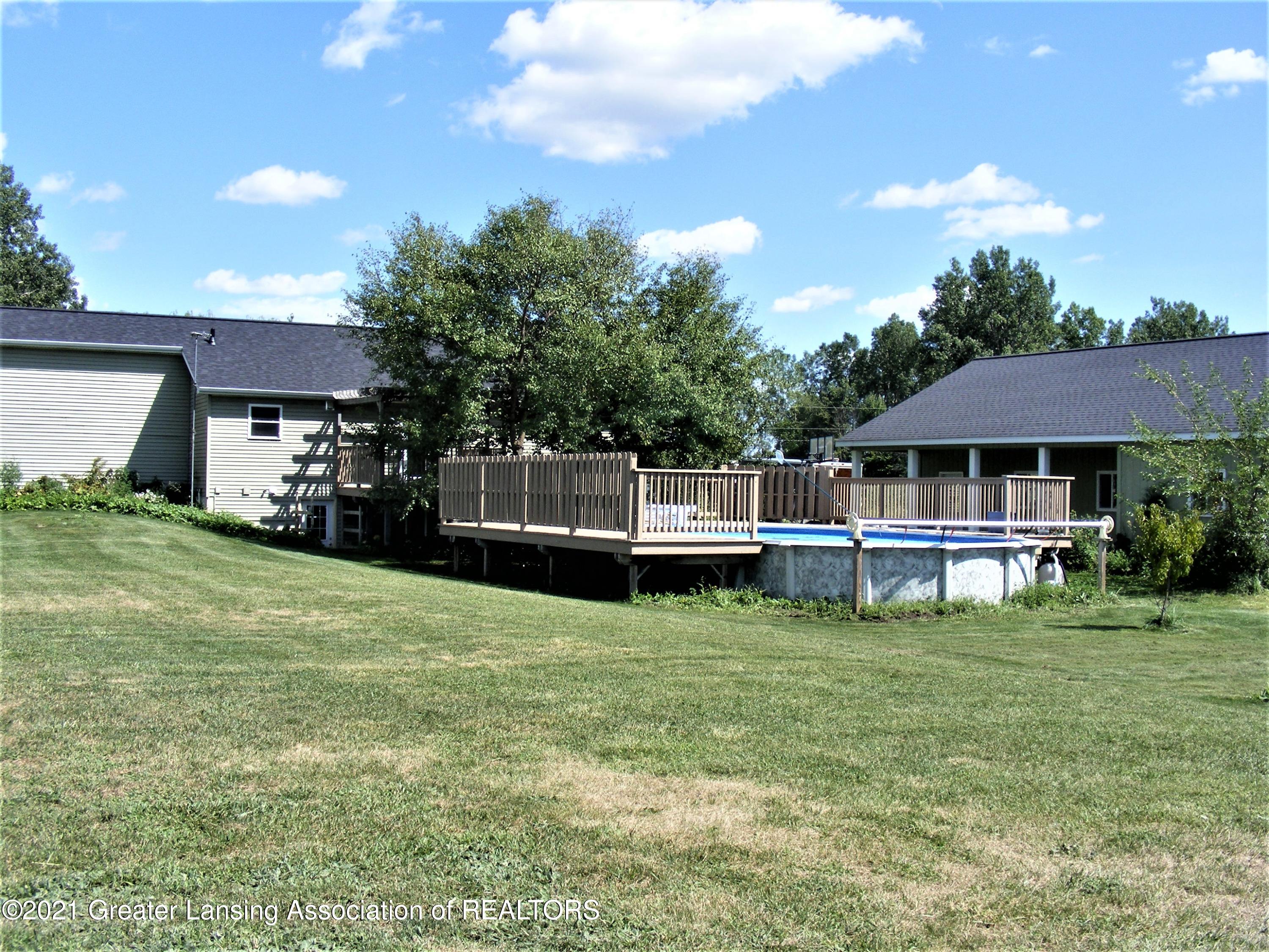 2430 South Meridian Road Ovid, MI 48866 - Photo 36 of 36 backyard pool and detached garage area