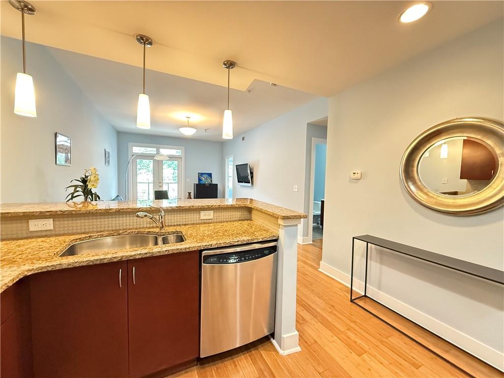 3655 Peachtree Road Northeast, Unit 304 Atlanta, GA 30319 - Photo 13 of 36 a view of a kitchen counter space and wooden floor