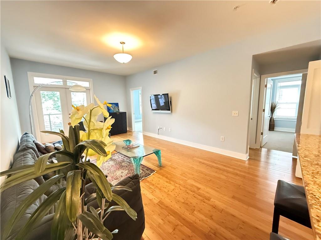 3655 Peachtree Road Northeast, Unit 304 Atlanta, GA 30319 - Photo 16 of 36 a view of a livingroom with furniture and a flat screen tv