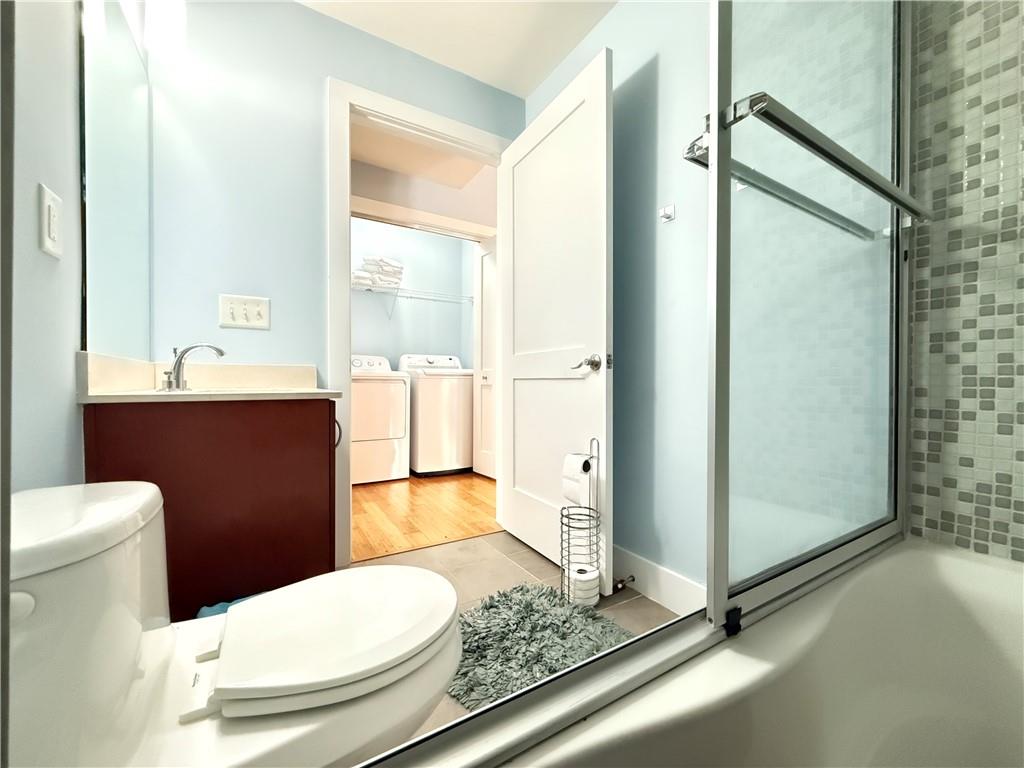 3655 Peachtree Road Northeast, Unit 304 Atlanta, GA 30319 - Photo 30 of 36 a bathroom with a toilet a sink and shower