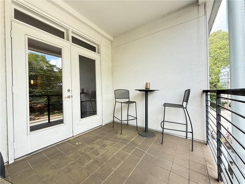 3655 Peachtree Road Northeast, Unit 304 Atlanta, GA 30319 - Photo 31 of 36 a view of a livingroom with furniture and windows