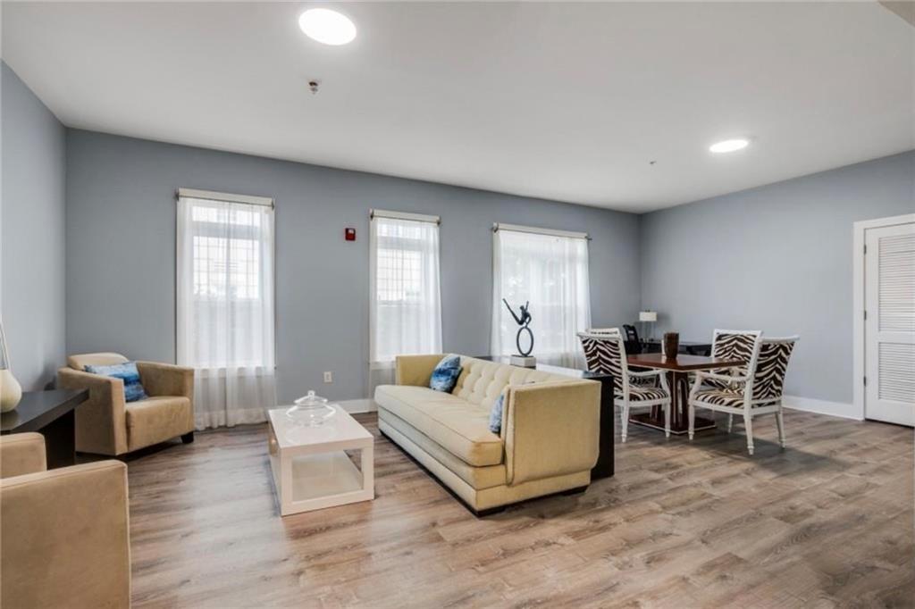 3655 Peachtree Road Northeast, Unit 304 Atlanta, GA 30319 - Photo 36 of 36 a living room with furniture and a large window