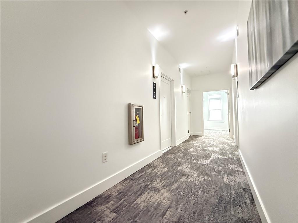 3655 Peachtree Road Northeast, Unit 304 Atlanta, GA 30319 - Photo 5 of 36 a view of a hallway with wooden floor
