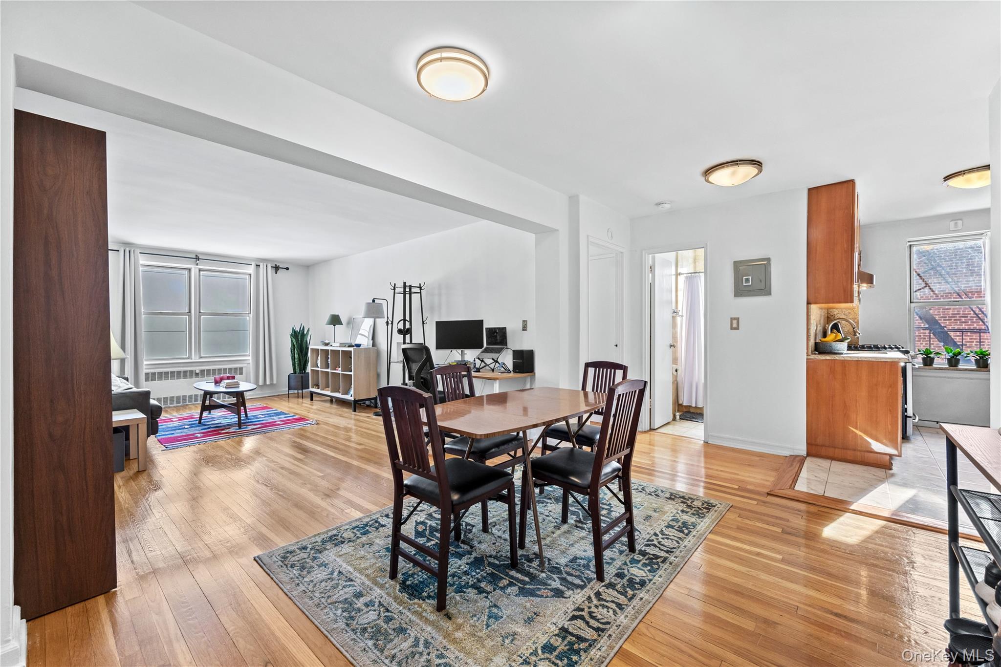 325 East 201st Street, Unit 5F Bronx, NY 10458 - Photo 1 of 19 a view of a dining room with furniture and wooden floor