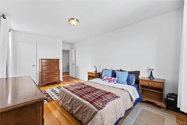 a bedroom with a bed and dresser