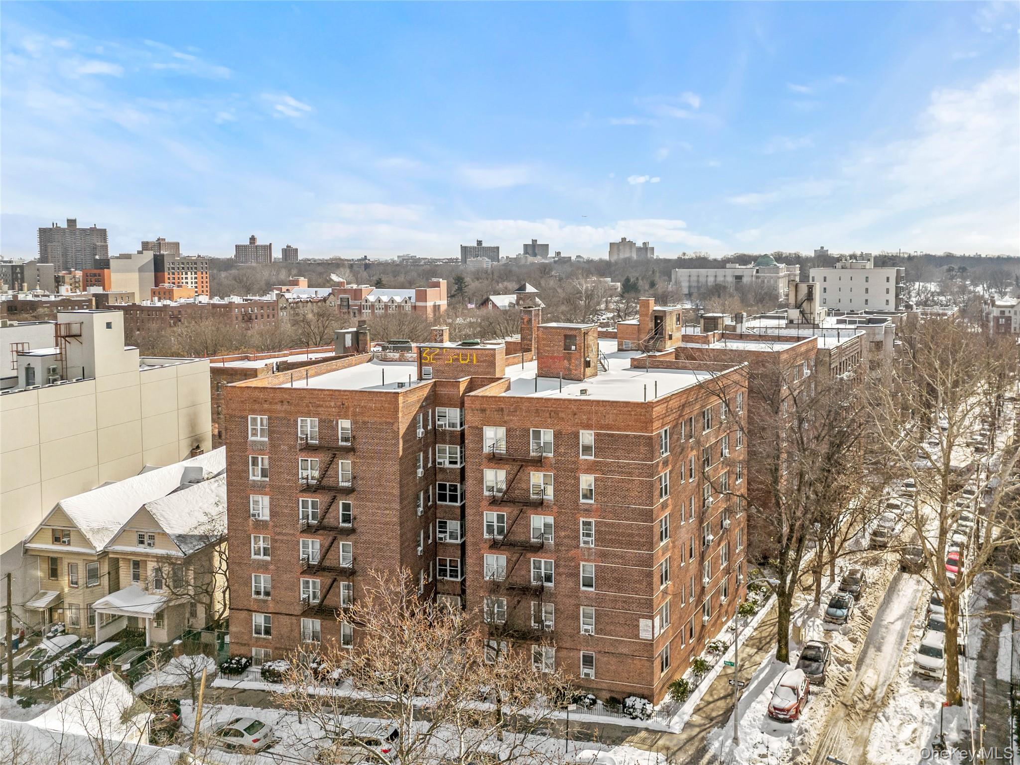 325 East 201st Street, Unit 5F Bronx, NY 10458 - Photo 17 of 19 a view of a city with tall buildings
