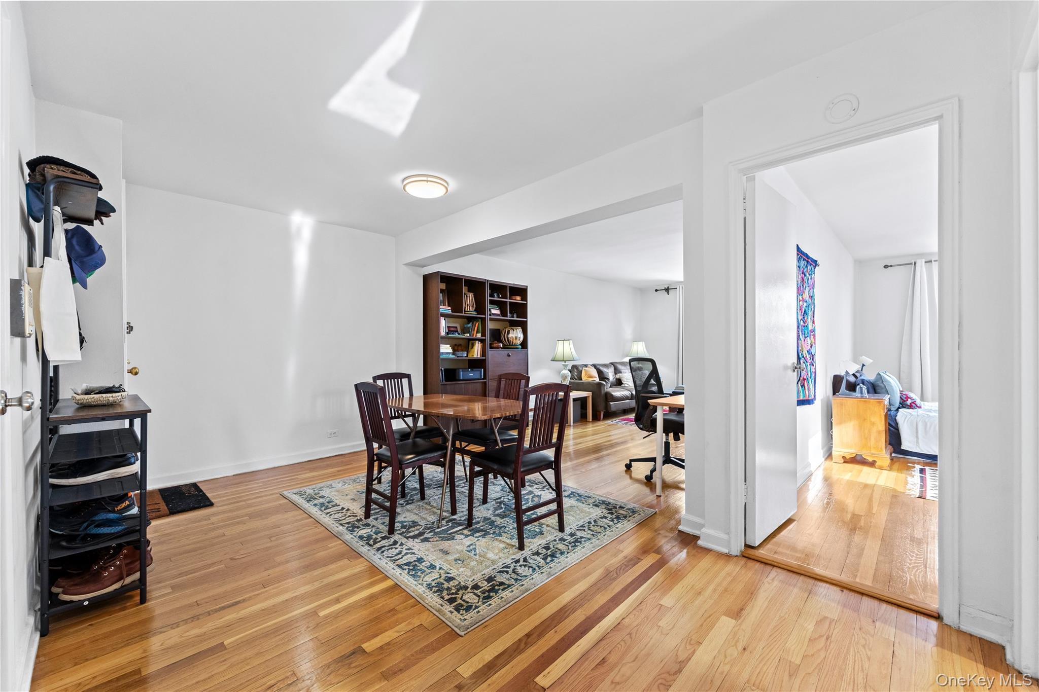 325 East 201st Street, Unit 5F Bronx, NY 10458 - Photo 2 of 19 a view of a dining room with furniture and wooden floor