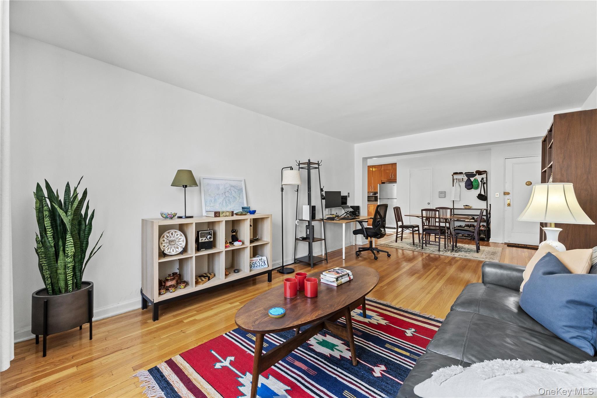 325 East 201st Street, Unit 5F Bronx, NY 10458 - Photo 4 of 19 a living room with furniture and a wooden floor