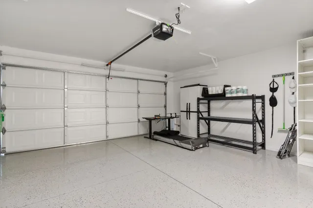 a kitchen with kitchen island a refrigerator stove microwave and cabinets