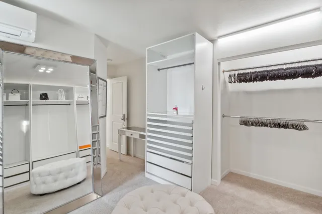a bathroom with a sink mirror and toilet