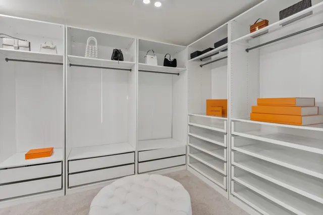 a bathroom with a tub shower and sink