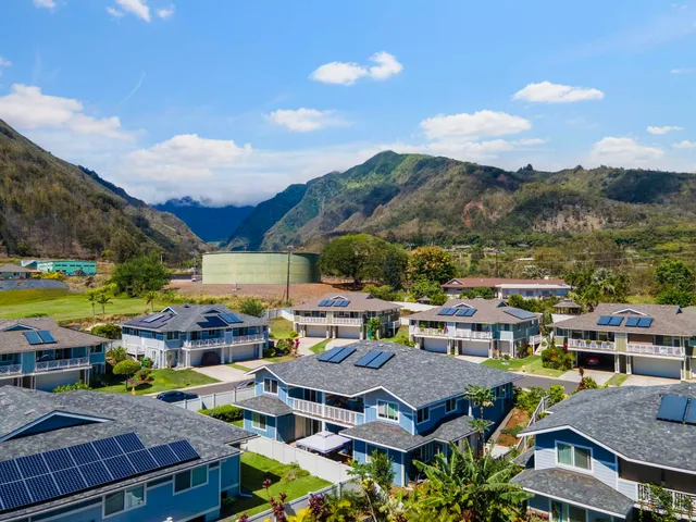 a view of houses with outdoor space and swimming pool
