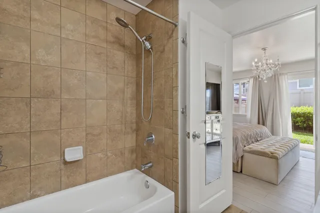 a bathroom with a granite countertop sink a toilet and a mirror