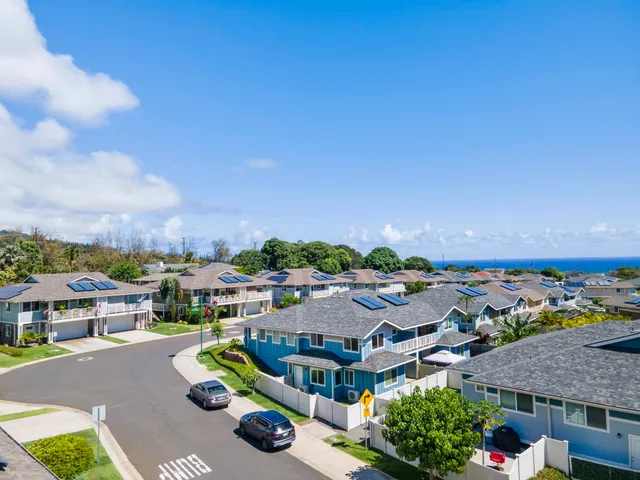 an aerial view of residential houses with outdoor space