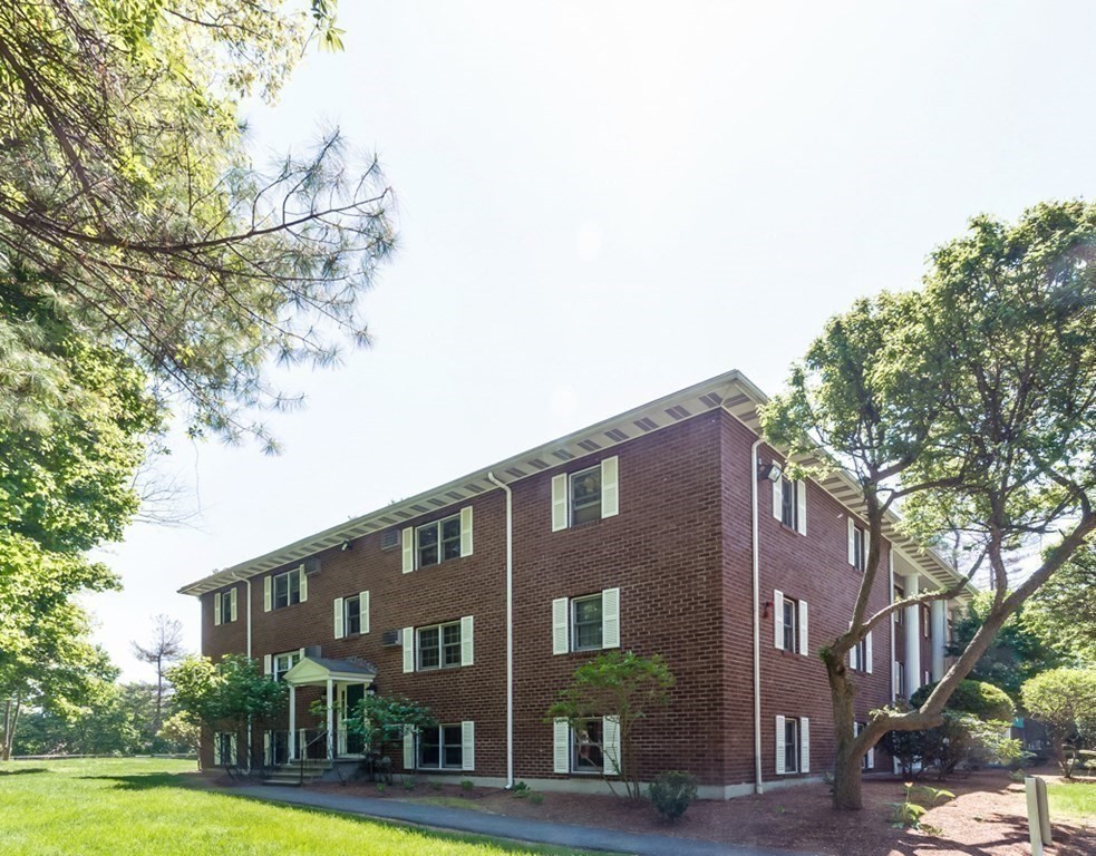 209 Great Road, Unit A 4 Acton, MA 01720 - Photo 11 of 14 a view of a building with a yard