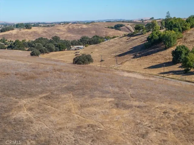 an aerial view of mountain with wooden fence