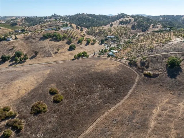 an aerial view of ocean with residential houses