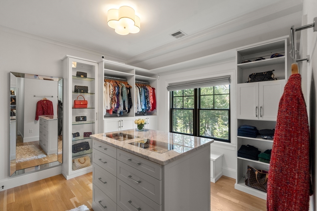 7 Massasoit Road Wellesley, MA 02481 - Photo 24 of 42 a kitchen that has a lot of cabinets in it