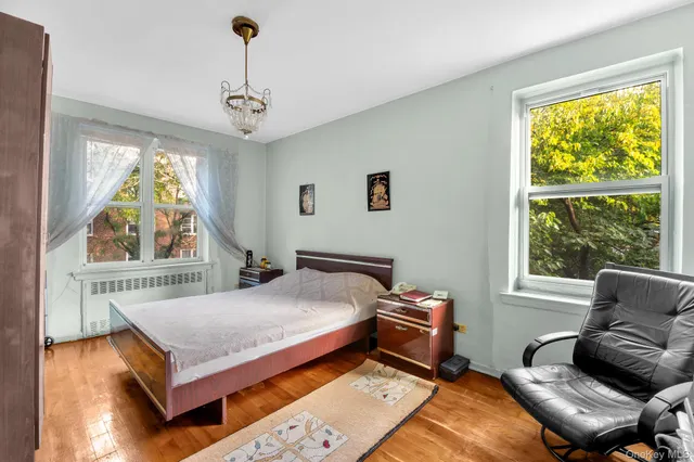 a bedroom with furniture and a window