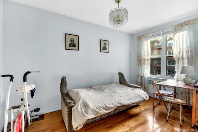 a bedroom with a bed and a table in it