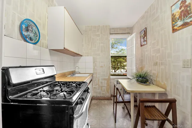 a kitchen with a stove and a table