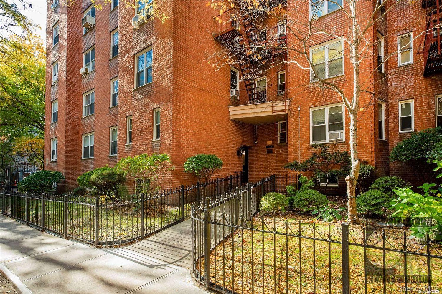 33-26 82nd Street, Unit 4C Queens, NY 11372 - Photo 8 of 10 a view of a house with a backyard