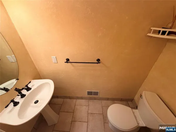 a bathroom with a toilet and a sink