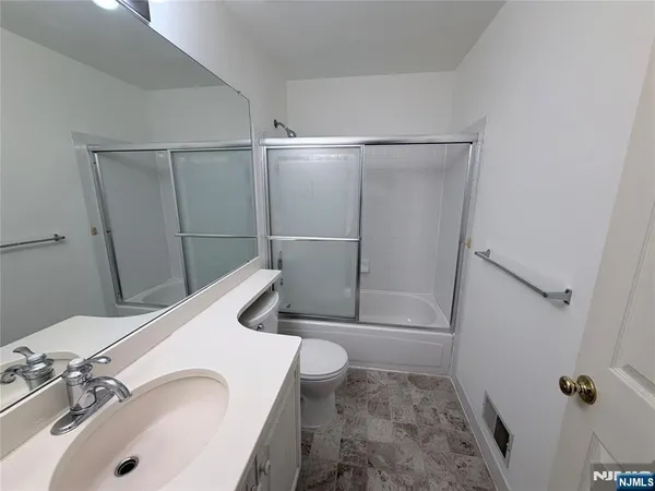 a bathroom with a sink and toilet