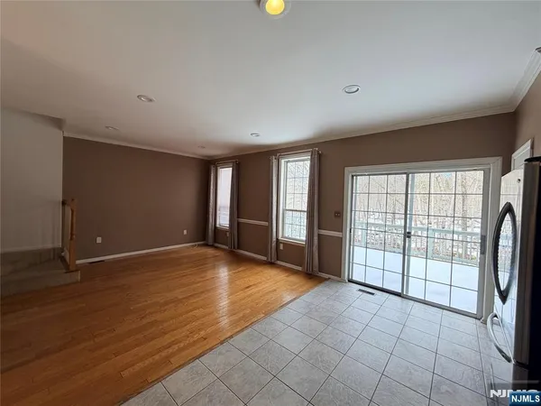 a view of an empty room with glass door