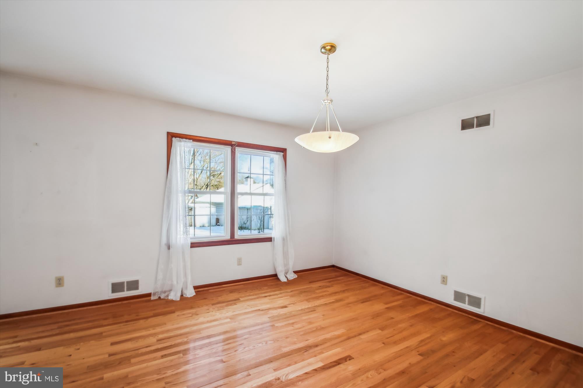 307 Ludlow Road Annapolis, MD 21401 - Photo 15 of 53 Dining Room with Wood Flooring & Window Treatments