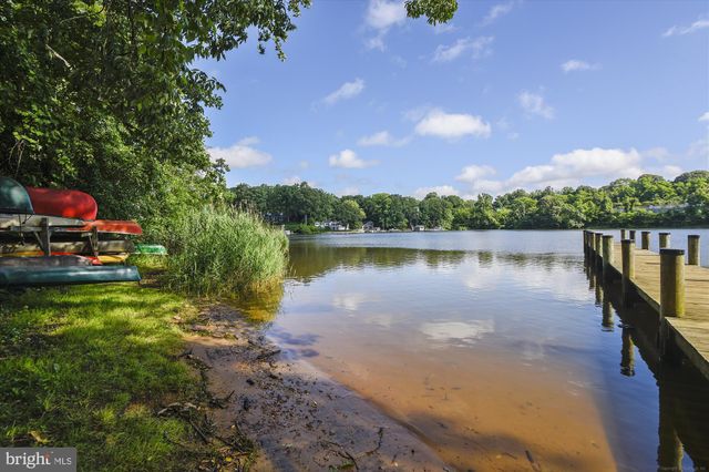 a view of a lake with a house in the background