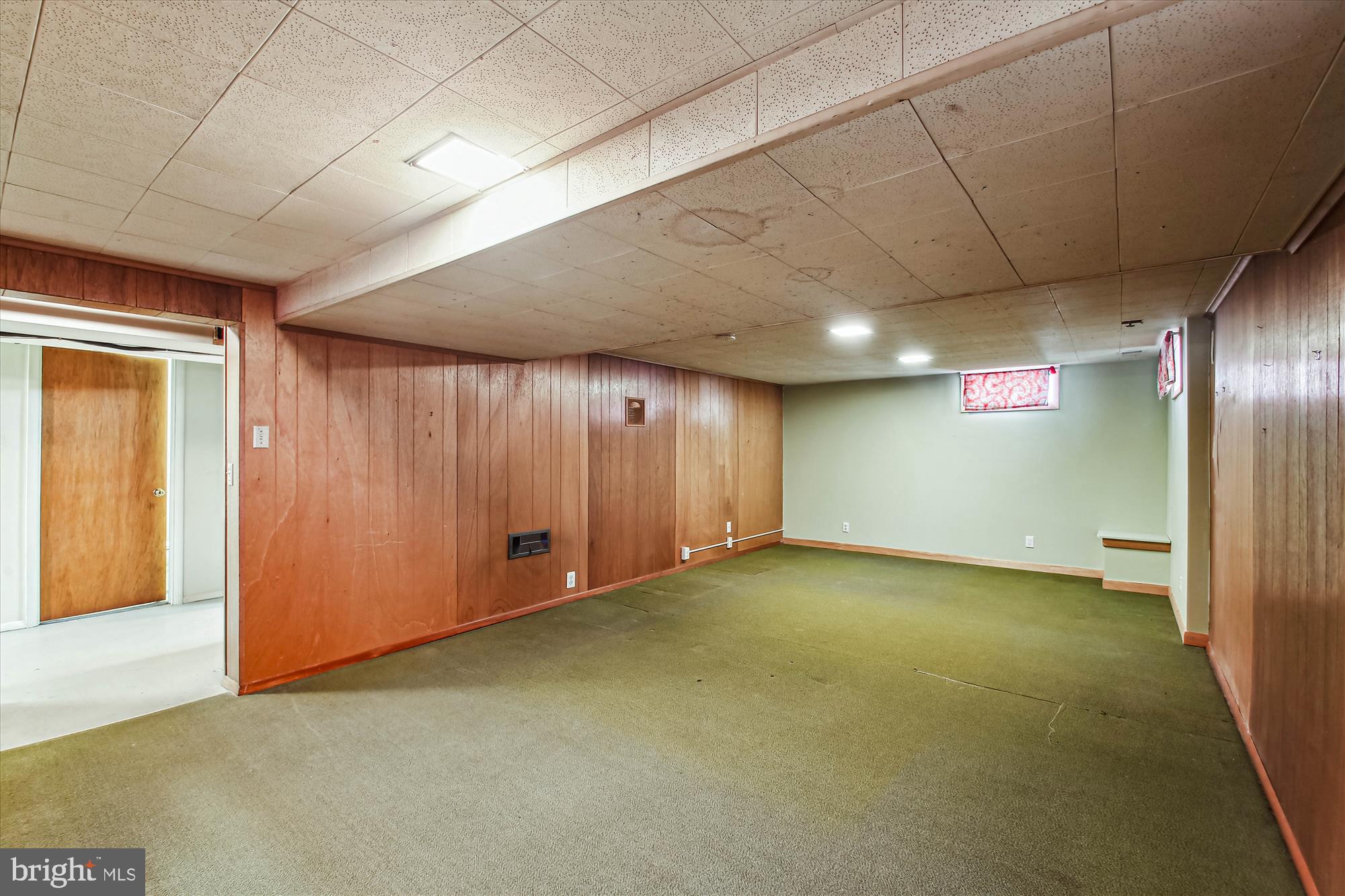 307 Ludlow Road Annapolis, MD 21401 - Photo 33 of 53 Basement Family Room with Paneling and Carpeting