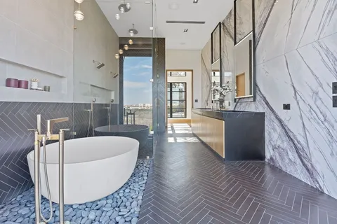 a large white tub sitting in a kitchen