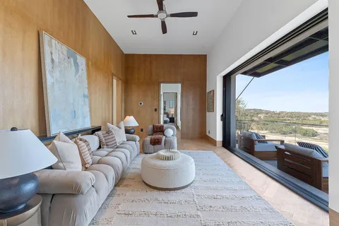 a living room with furniture and a large window