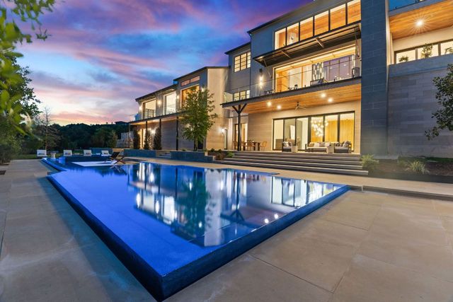 a view of a balcony with chairs