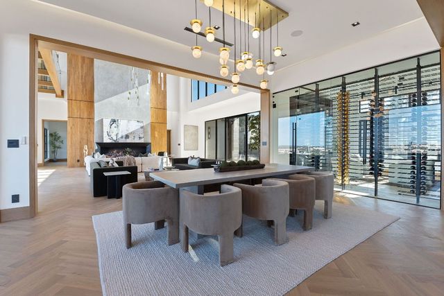 a view of a livingroom with furniture window and wooden floor