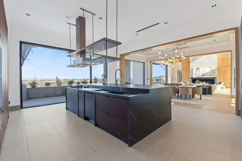 a kitchen with stainless steel appliances granite countertop a stove and a sink