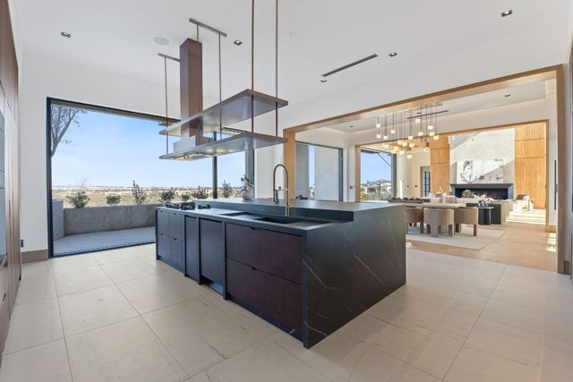 a kitchen with stainless steel appliances granite countertop a stove and a sink