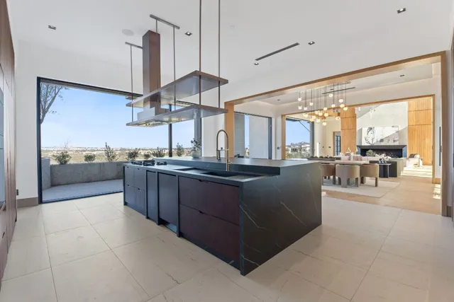 a kitchen with stainless steel appliances granite countertop a stove and a sink