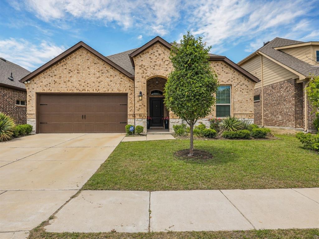 3024 Meredith Lane Forney, TX 75126 - Photo 1 of 29 Brick facade with stone accents, a two-car garage, and a covered entry