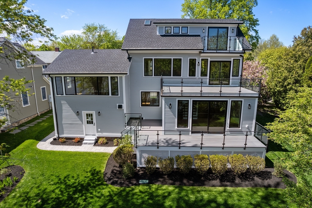 121 Oliver Road Belmont, MA 02478 - Photo 1 of 34 a front view of a house with garden