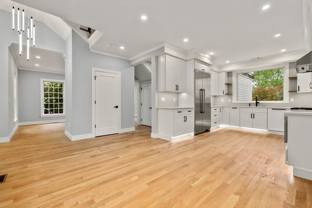 121 Oliver Road Belmont, MA 02478 - Photo 12 of 34 a large kitchen with kitchen island a sink stainless steel appliances and cabinets