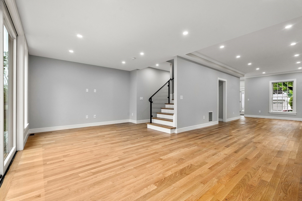 121 Oliver Road Belmont, MA 02478 - Photo 14 of 34 a view of an empty room with wooden floor and window