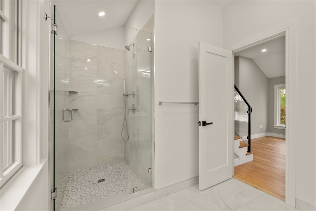 121 Oliver Road Belmont, MA 02478 - Photo 20 of 34 a bathroom with a shower and a glass door