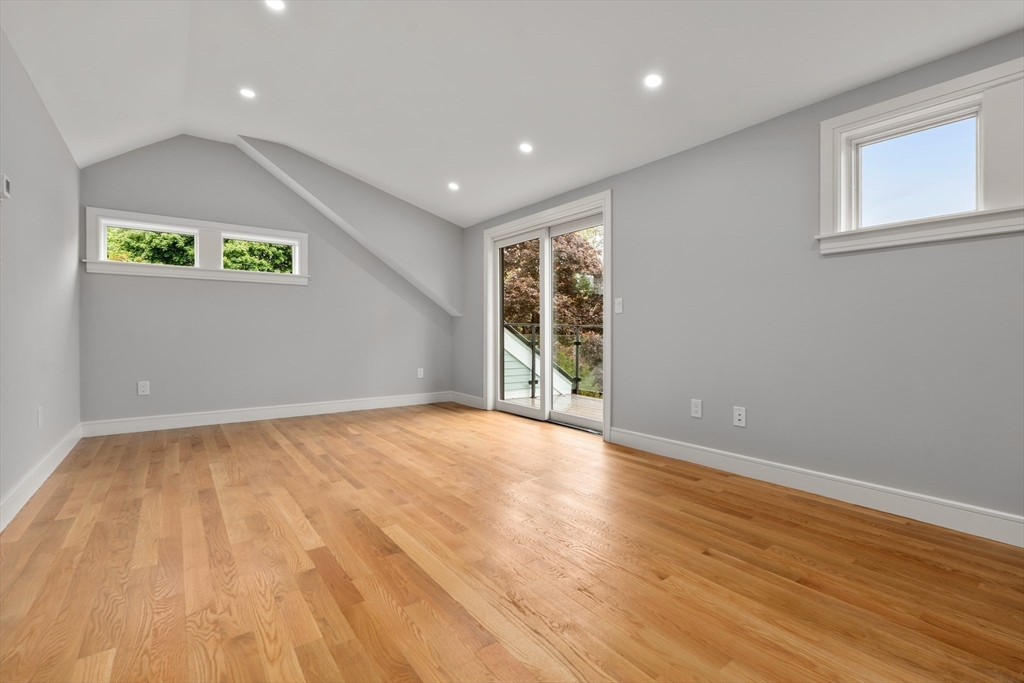 121 Oliver Road Belmont, MA 02478 - Photo 25 of 34 a view of an empty room with wooden floor and a window