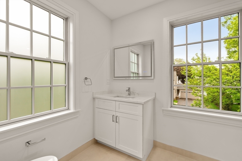 121 Oliver Road Belmont, MA 02478 - Photo 28 of 34 a bathroom with a window a sink and a window