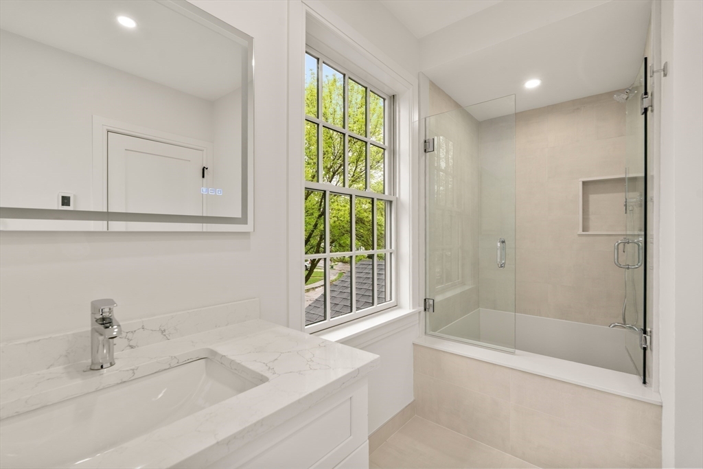121 Oliver Road Belmont, MA 02478 - Photo 29 of 34 a bathroom with a tub sink and mirror